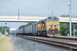 UP 6393 shoves an empty stone train under First Street